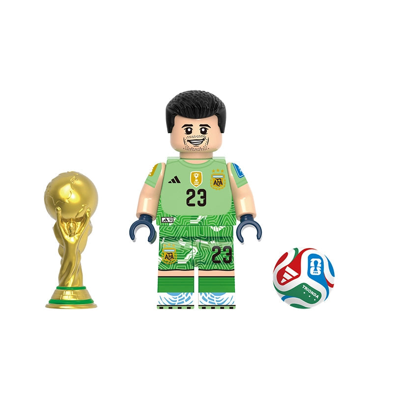 A soccer-themed building block minifigure named Emiliano Martínez, wearing a green Argentina national team goalkeeper jersey and shorts with the number 23. The set includes a gold FIFA World Cup trophy and a red, white, and blue soccer ball, all on a plain white background with the model number GH0810 at the top and the name of the player at the bottom.