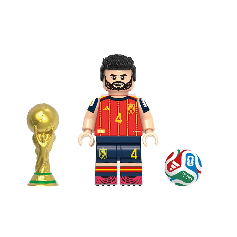 A soccer-themed toy minifigure named Eric García, styled like a Spain national team player in a red and navy jersey with the number 4, shown alongside a gold FIFA World Cup trophy and a soccer ball on a white background.