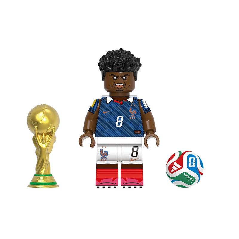 A soccer-themed toy minifigure labeled Tchouaméni with a gold FIFA trophy, a soccer ball, and the model number GH0831 on a plain white background.