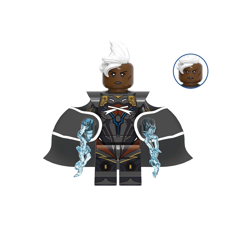 A custom block-style minifigure of Storm from Marvel, featuring dark skin, white hair, a black and gray cape, and blue energy effects on her arms, shown on a plain white background with a model number 'GHO969' at the top.