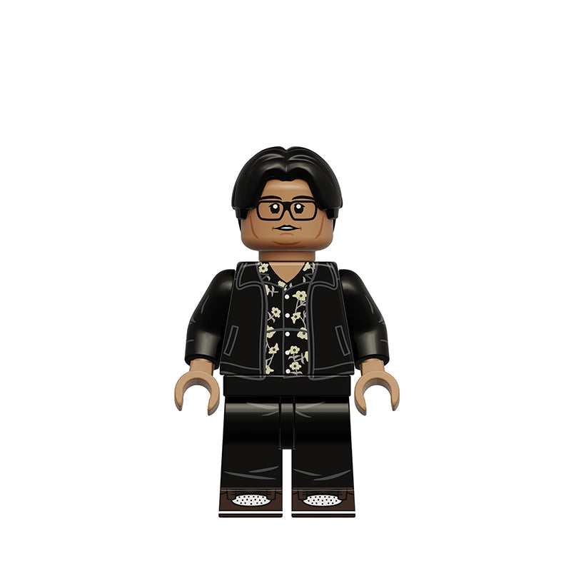 A custom-built toy minifigure of Ned Leeds from Breaking Bad, featuring black hair, glasses, a black jacket over a black-and-white patterned shirt, and black pants, shown on a plain white background with the text 'K2428 Ned Leeds' in the upper left.