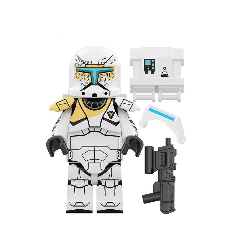 Toy figure with white helmet and yellow accents, holding a weapon, on a white background.
