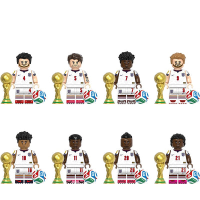 A product display sheet showing eight soccer-themed toy building-block figures arranged in two rows on a white background, each with a gold trophy and a small striped ball. The top text reads 'G0206'.