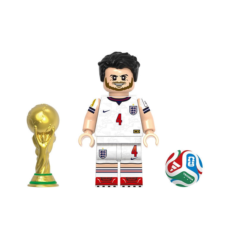 A toy minifigure labeled 'Rice' shown with a gold trophy and a soccer ball on a plain white background. The figure wears a white England-style football jersey with the number 4 and crest, black hair, and beige skin tones.
