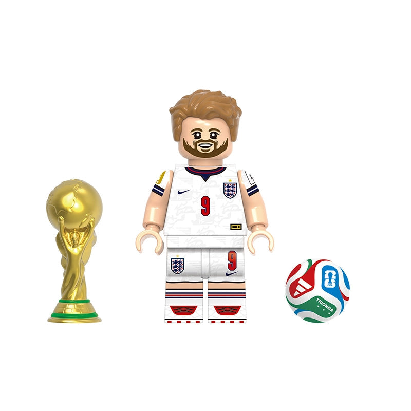 A toy soccer player minifigure labeled 'Kane' with a white England jersey, shown alongside a gold trophy and a multicolor soccer ball on a plain white background. A gray label at the top reads 'GHO823'.