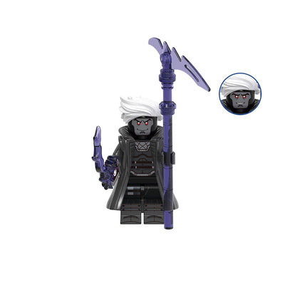 A building block minifigure labeled 'Gambit' with the code 'GHO959' above it. The figure has white hair, a dark gray face and chest, a black robe, and holds a purple staff with a curved blade.
