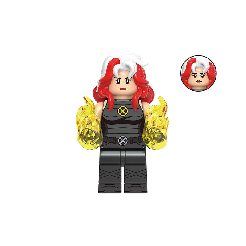 A custom toy minifigure of Rogue from X-Men, featuring red and white hair, a black bodysuit with a yellow X emblem, and yellow energy effects on her arms. The image includes a grey label with the code 'GHO972' at the top and the name 'Rogue' at the bottom, along with a circular inset showing a close-up of her head.