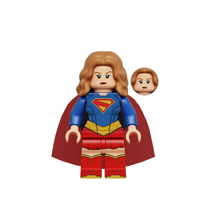 A building block minifigure of Supergirl with wavy light brown hair, a blue bodysuit with a red and yellow S-shield, red skirt, and red cape, shown on a white background with a small inset of an alternate face and text reading K2399 Supergirl.