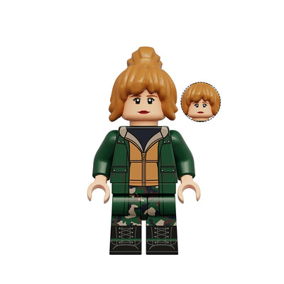 A custom building block minifigure of Jean Grey from Xmen, featuring brown hair, a green and tan jacket, and green camouflage pants, shown with an alternate head on a white background.