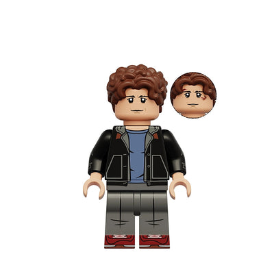 A custom toy minifigure of Peter Parker from Marvel, featuring brown curly hair, a black jacket over a blue shirt, gray pants, and red shoes, shown with an alternate head on a white background.