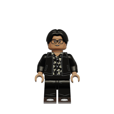 A custom-built toy minifigure of Ned Leeds from Breaking Bad, featuring black hair, glasses, a black jacket over a black-and-white patterned shirt, and black pants, shown on a plain white background with the text 'K2428 Ned Leeds' in the upper left.