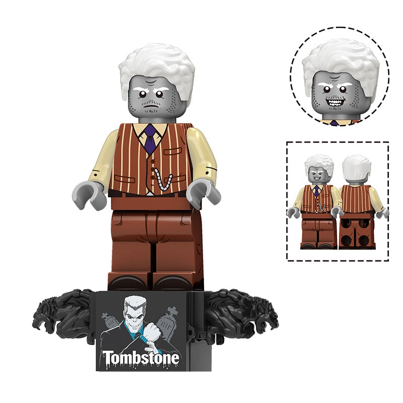 A building block minifigure of the character Tombstone from The Godfather, shown on a display base with a close-up inset of the head and a side view inset. The figure has white hair, a gray face, a brown striped vest, a yellow shirt, a blue tie, and brown pants, standing on a black base with black hair details.